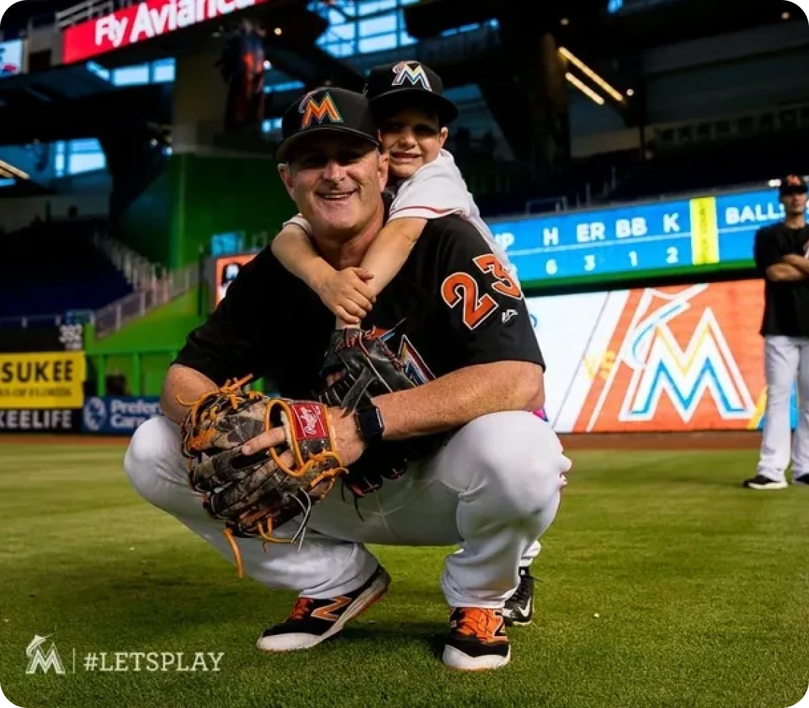Father and son in baseball gear