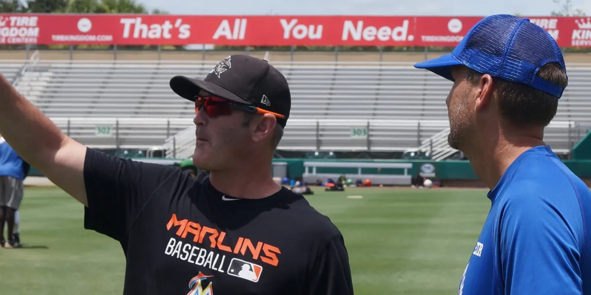 Baseball coaches discussing on the field
