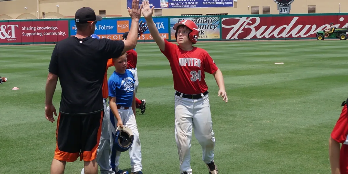 Youth baseball team practicing outdoors