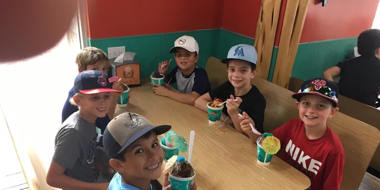 Kids enjoying ice cream at a table
