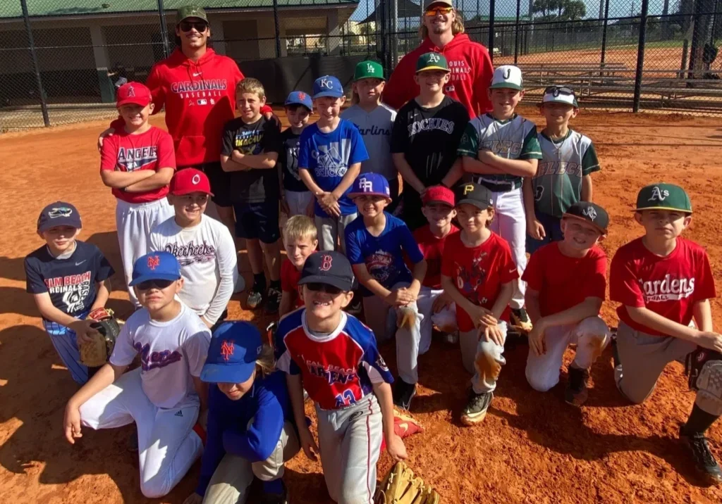 Youth baseball team posing on field