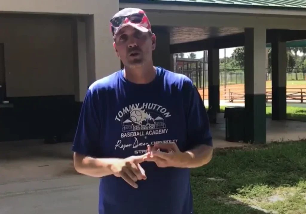 Man in blue shirt outside pavilion