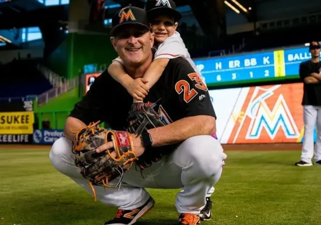 Father and child at baseball game