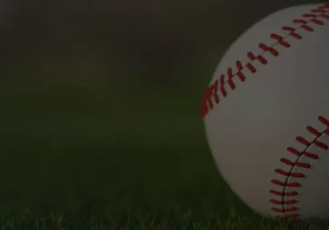 Baseball on grassy field