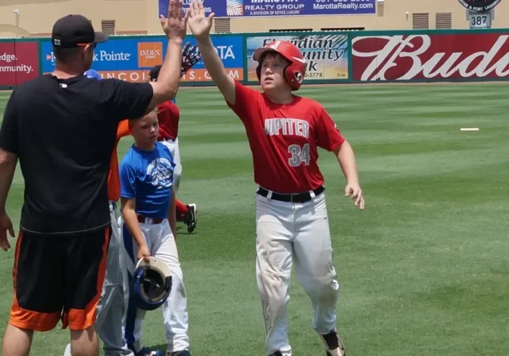 Youth baseball team practicing outdoors